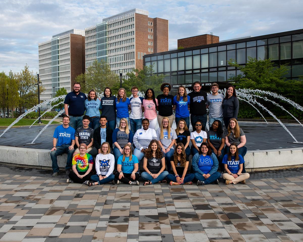 several student leaders gathered around the fountain for a group photo